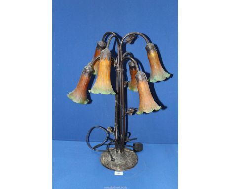 A six branch Lily type table Lamp with cast metal dragonfly base with orange/green shades, 25'' tall.