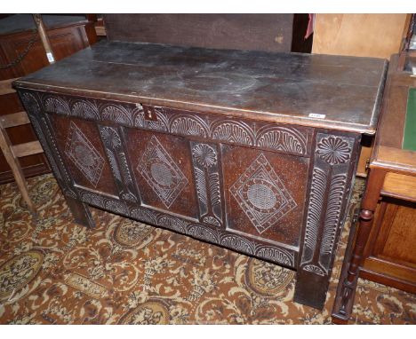A three panel Oak Blanket Chest/Coffer having carved decoration to the front, 51'' wide x 21'' deep x 30 3/4'' high approx.