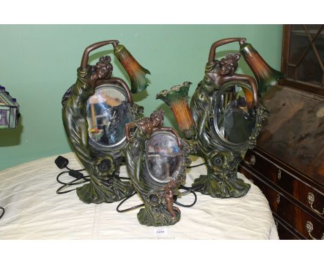 A pair of Figural Lamps of a Lady arching over a mirror with green and orange shade, 21'' tall plus a similar Lamp, 15 3/4'' 