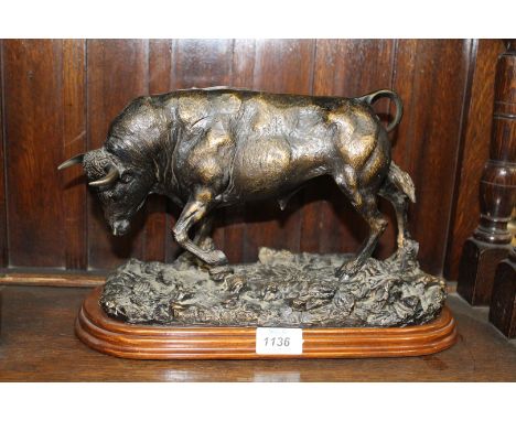 A heavy composite model of a Bull on plinth, 13 1/2" x 9".