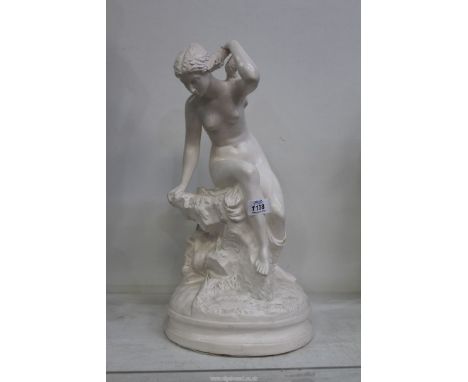 A contemporary model of a nude in classical pose on a rock, 18" tall.