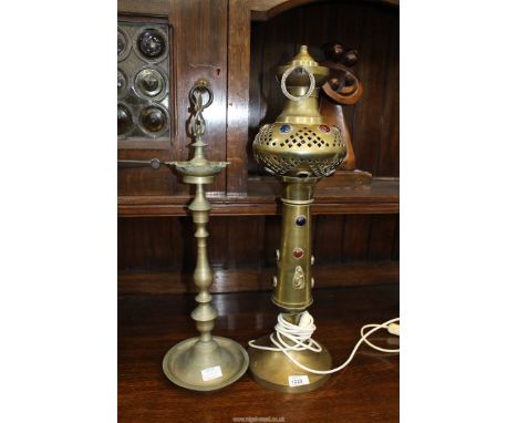 An Indian metal lamp base with inset polished stones converted for electric 25" tall and a metal stand.