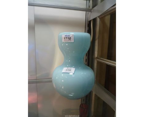 A vintage gourd shaped heavy Glass vase having inverted rim, light blue, 8" tall, 6" wide.