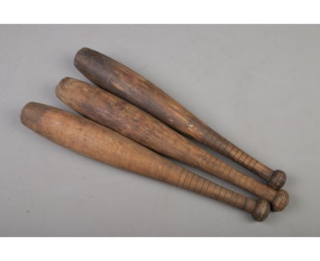 A set of three vintage juggling batons  