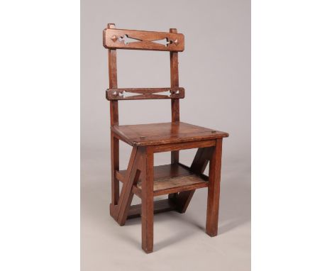 An Arts &amp; Crafts oak metamorphic library step chair. Height of steps 88cm.  