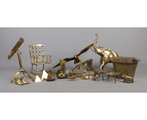 A good collection of brasswares, to include Oriental octagonal planter, rocking chair, elephant, eagle and tripod telescope. 