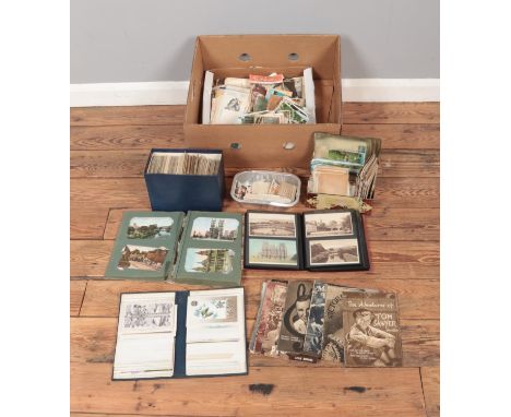 A box containing a good collection of postcards and cinema ephemera to include Cinegram magazine, Film stars cigarette cards,