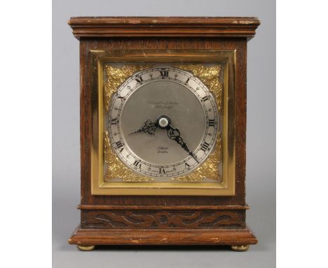 A mahogany cased Elliott mantle clock, with Roman Numeral dial inscribed 'Hamilton &amp; Inches', Edinburgh. 17cm high.  