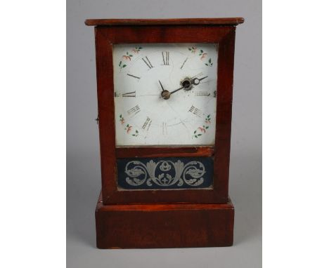 An Ansonia Brass Co mantel clock with painted glass panel to front.  
