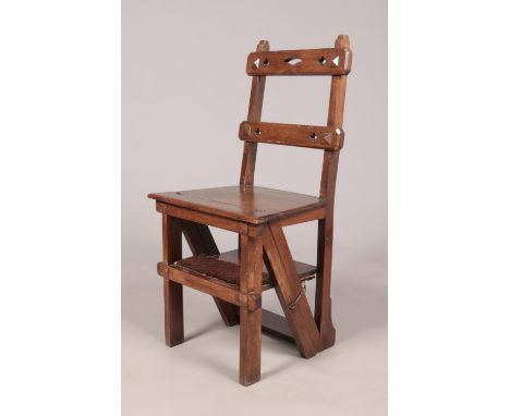 An Arts &amp; Crafts mahogany metamorphic library step chair. Height of steps 90cm.  Loose joint towards top of steps. Not ov