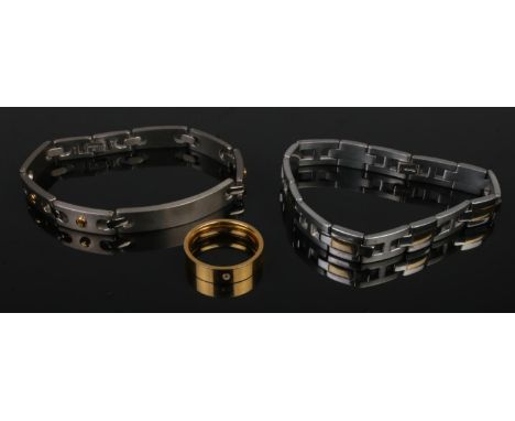 Two titanium bracelets along with a gilt titanium ring.  