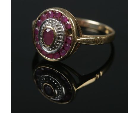 A vintage 9ct gold ruby set ring. Size O, 2.65g.  Missing one stone.