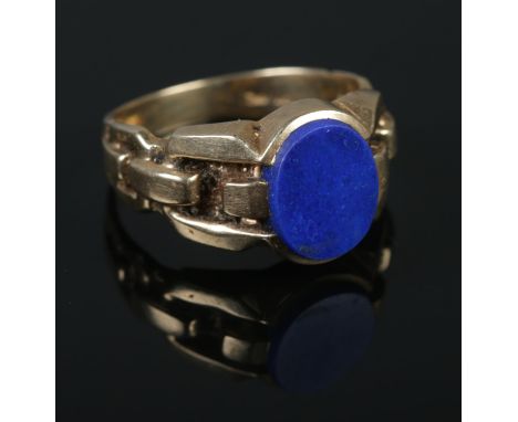 A 10ct gold ring set with lapis lazuli stone. Size V. 8.55g.  