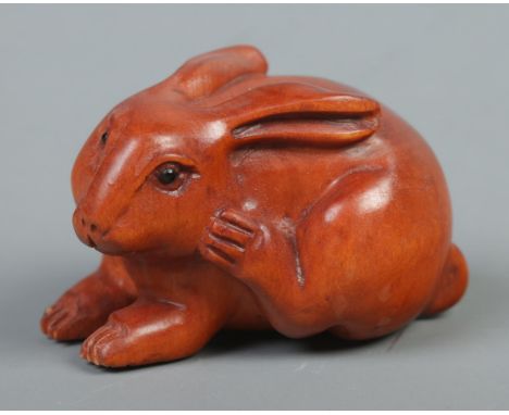 A Japanese carved Netsuke in the form of a rabbit  