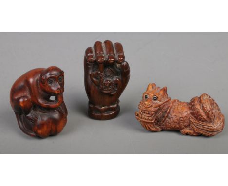 Three Japanese carved Netsuke. Includes monkey, dragon, etc.  