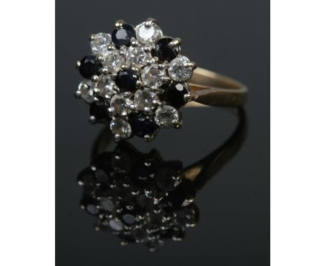 A 9ct sapphire and cubic zirconia cluster ring. Size J, 2.5g.  