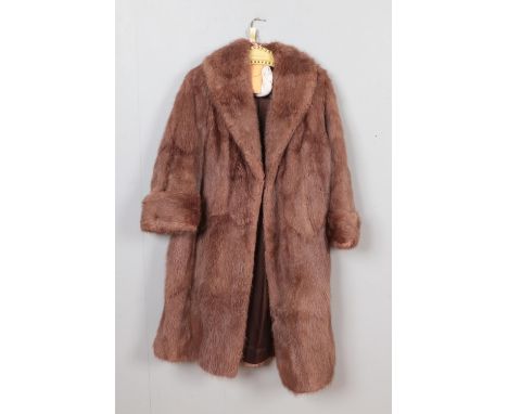 A vintage light brown three quarter length coat  