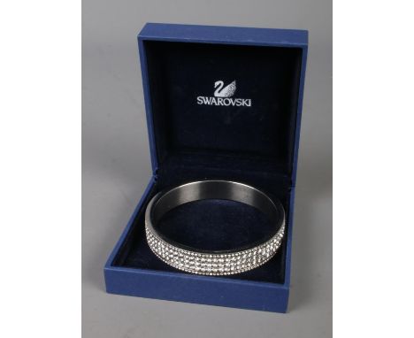 A boxed Swarovski crystal white metal bangle.  