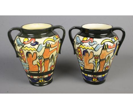 A pair of 'Charlotte Rhead' Crown Ducal twin handled vases decorated with Egyptian scenesHx24.5cm  Damage to rim of one vase