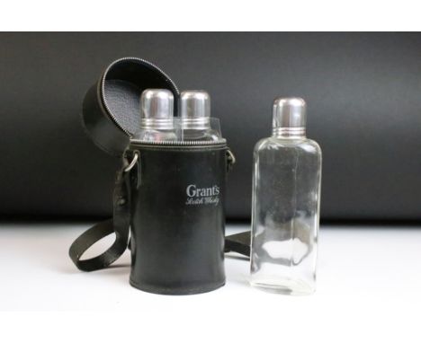 Grants Scotch Whisky set of three glass spirit flasks within case with carry strap. Measures approx 19.5cm high