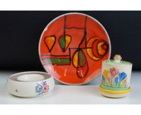 Clarice Cliff Newport Pottery crocus pattern sugar bowl with lid, together with a Poole pottery posy ring and Poole pottery d