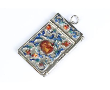 A white metal and enamel pocket notebook with floral enamel decoration. 