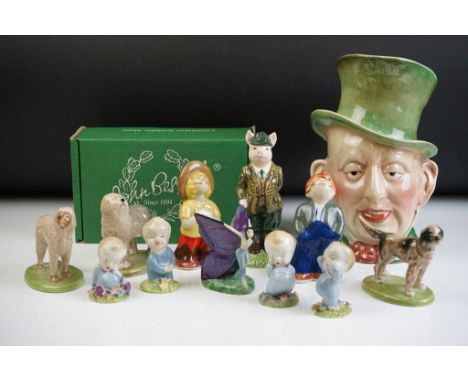 Collection of ceramic figurines to include Beswick gentleman pig and Micawber character jug, five Wade figurines, Carlton War