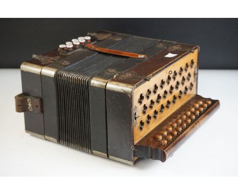 A vintage walnut cased Stahl tone accordion 