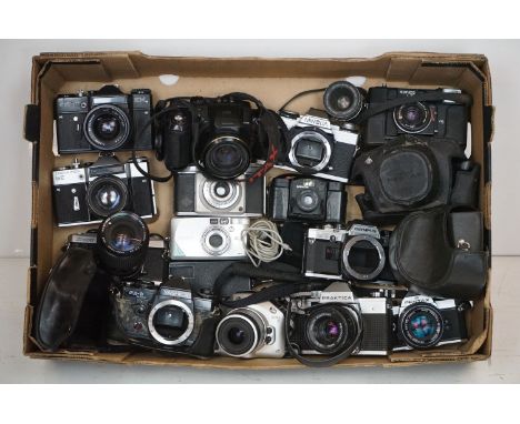 Collection of SLR and 35mm film cameras, mainly with lenses, to include Canon, Olympus, Zenit, Minolta and Minox examples 