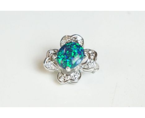 A silver and opal four leaf clover brooch 