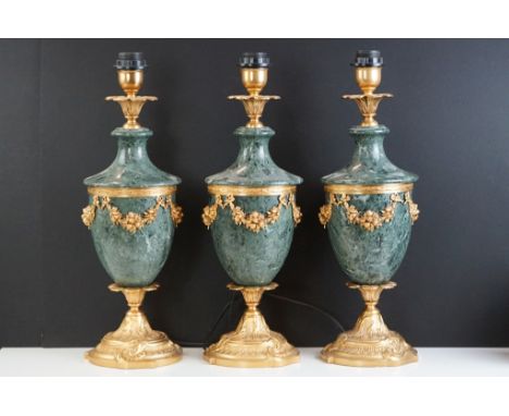 Set of three 'L'Originale' Italian gilt metal &amp; marble table lamps, of urn form, with floral sconces, garland decoration,
