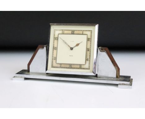 Art Deco Smiths '8 Days' chrome mantle clock, the revolving square face raised upon a stepped rectangular base, approx 18cm w