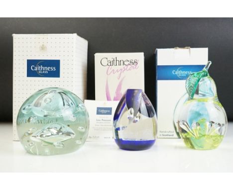 Three Caithness paperweights to include a Windfall pear paperweight, a golden jubilee regal reflection paperweight and a 'low