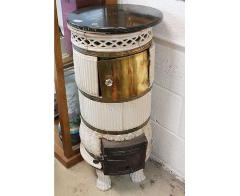 Early 20th century French Cast Iron and Ceramic Circular Stove with marble top, the cast iron door marked ‘ Jack Era Colmar ‘