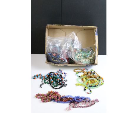 A collection of vintage costume jewellery beaded necklaces to include stone, glass and wedding cake beads. 