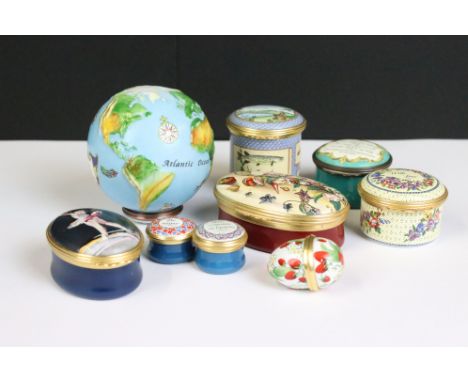 A collection of nine enamel trinket boxes to include Halcyon Days examples. 