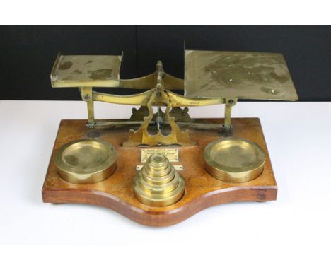 Set of brass inland postal scales, complete with weights (ranging from 1oz to 4lb), with ivorine rates label, raised on an oa