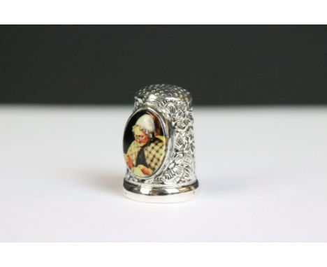 A silver thimble with enamel panel 