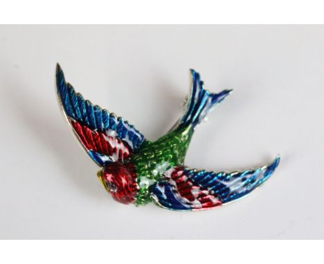 A silver and enamel bird brooch 