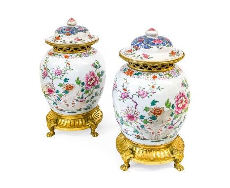 A Pair of Gilt-Metal-Mounted Chinese Porcelain Jars and Matched Covers, 18th century and later, of ovoid form, painted in fam