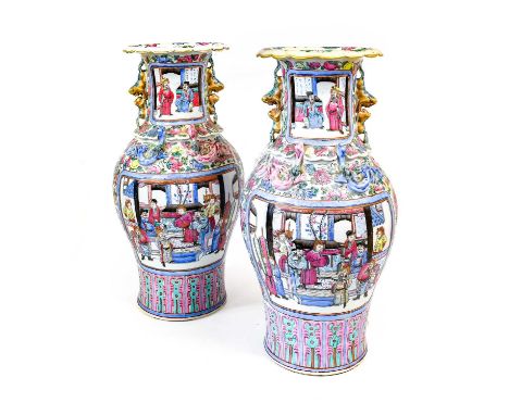 A Pair of Chinese Porcelain Baluster Vases, mid 19th century, the trumpet necks with mythical beast handles, painted in famil