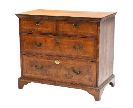 A George II Walnut, Crossbanded and Featherbanded Straight-Front Chest of Drawers, 2nd quarter 18th century, the quarter-vene