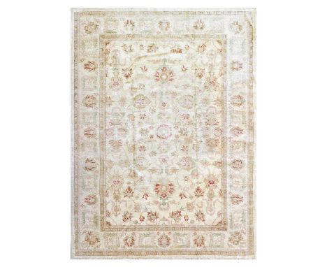 Afghan Ziegler Carpet, circa 1990The ivory field of large scrolling vines centred by a small cusped flowerhead medallion, enc