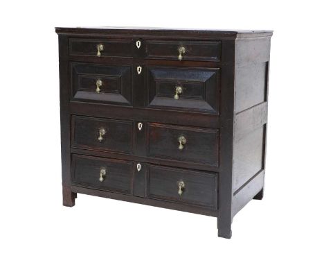 A Late 17th Century Oak Straight-Front Chest of Drawers, the boarded top above four oak-lined two-as-one long drawers with la