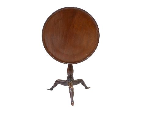 ~ A George III Mahogany Manx-Style Tripod Table, late 18th century, the circular dished flip top above a turned spindle birdc