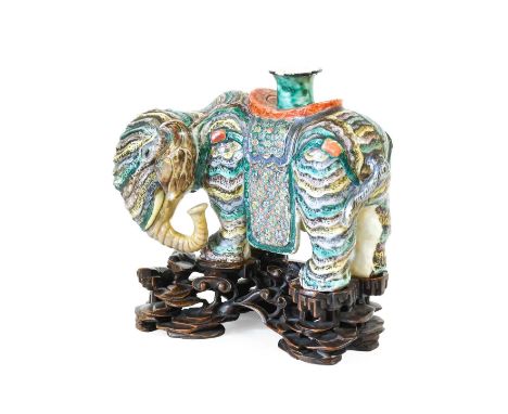 A Chinese Porcelain Incense Burner, in the form of an Elephant, probably Jiaqing, standing four-square, the nozzle on its bac