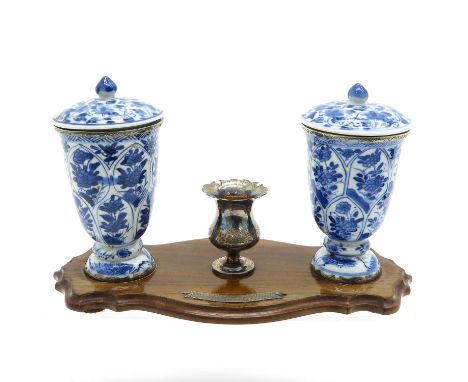 Consisiting of two Kangxi Period cups with covers, mounted with silver, 26 cm. long.