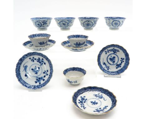Blue and white floral decor, saucers are 12 cm. in diameter, chip and hairline.