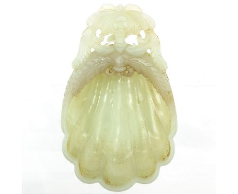 Very fine detailed floral carvings in the shape of a shell, reverse also carved with flowers and small ring, 12 cm. long. 