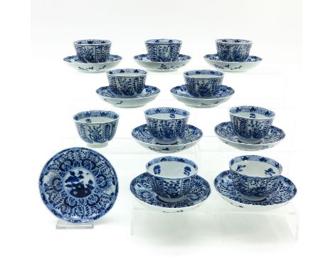Including 10 cups and saucers, saucers are 13 cm. in diameter, blue and white decor, chip and hairline.